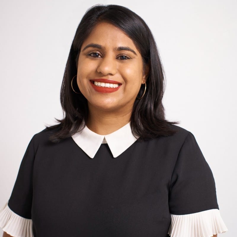 Ishanee Parikh’s profile picture. The person is smiling and looking at the camera.